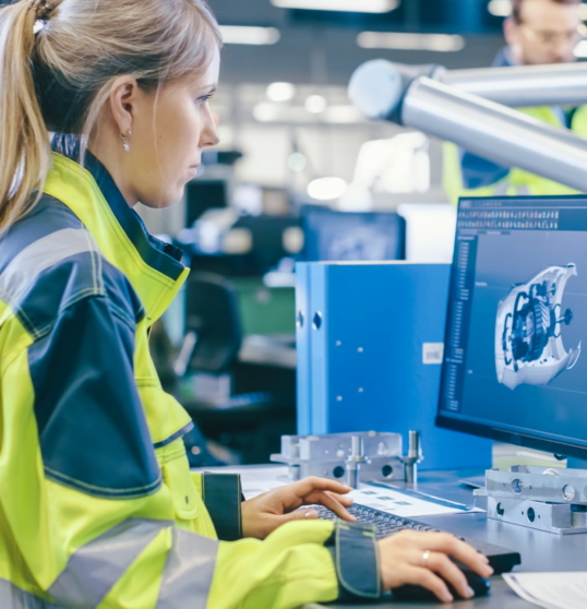 woman working on a 3D model on a computer