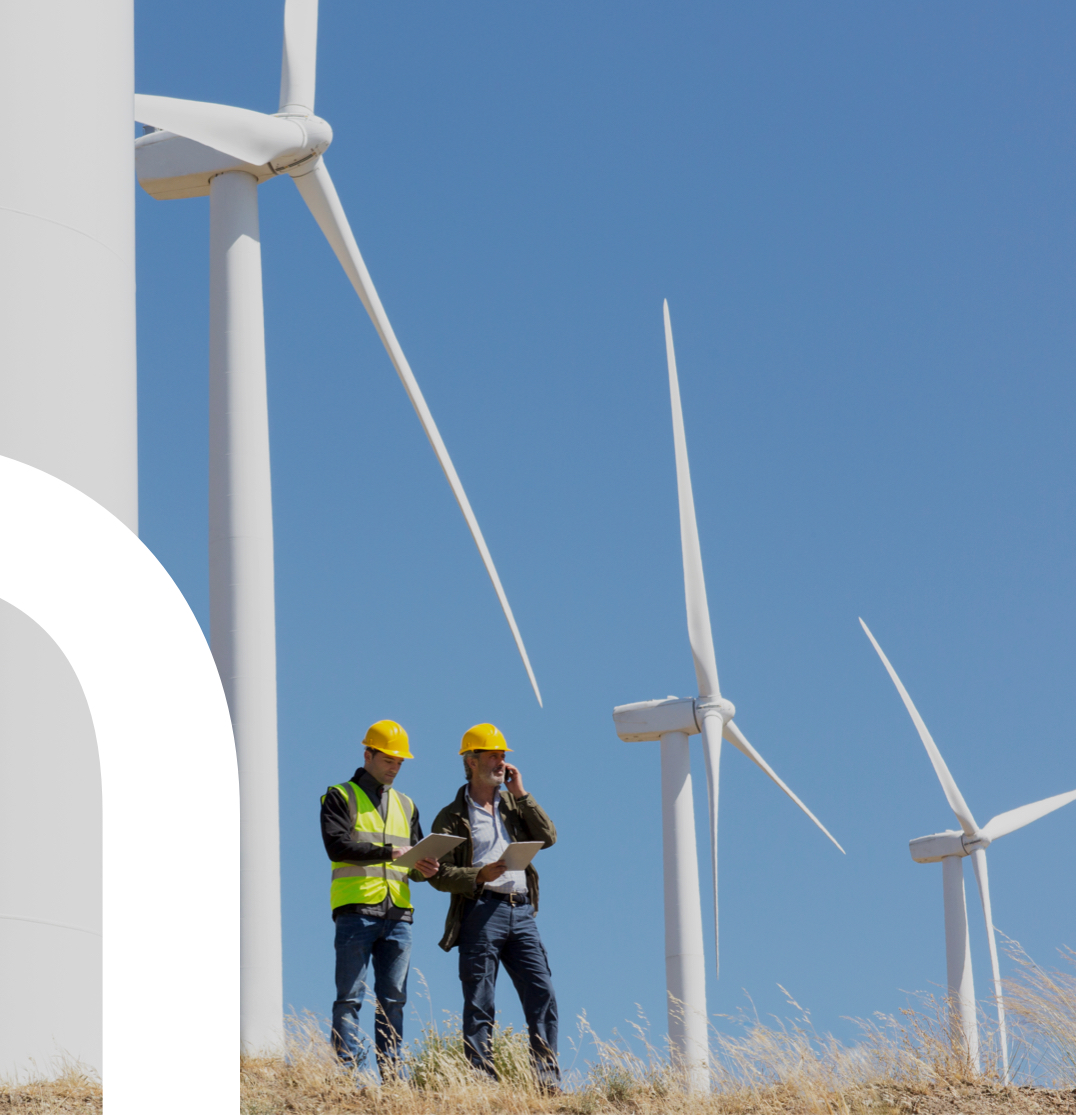 construction workers surveying windmills